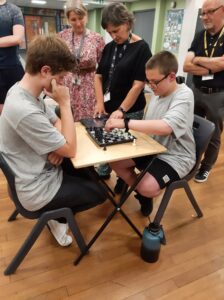 2 pupils playing chess from Ambergate