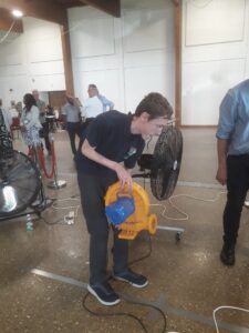 Ambergate Pupils STEM Challenge pupil using a wind machine