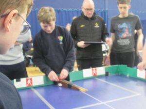 Children playing tabletop cricket
