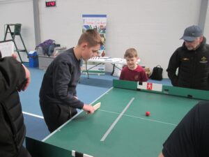 Children playing tabletop cricket