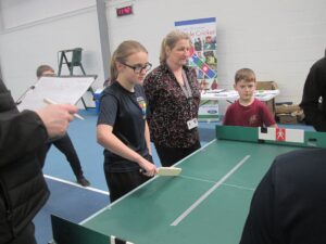 Children playing tabletop cricket