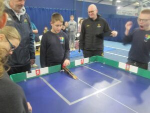 Children playing tabletop cricket