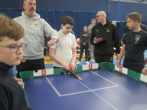 Children playing tabletop cricket