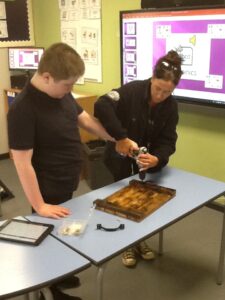 Sandon Pupil making wooden shelves