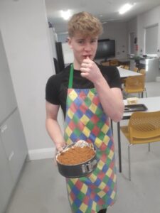 Ambergate Pupil with the cheesecake they had made