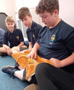 3 children with lizard