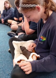 children with a hairless guinea pig