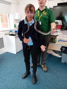 girl with snake around her neck