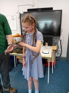 girl with snake around her neck